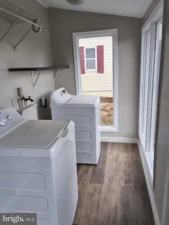 a kitchen with a refrigerator and window