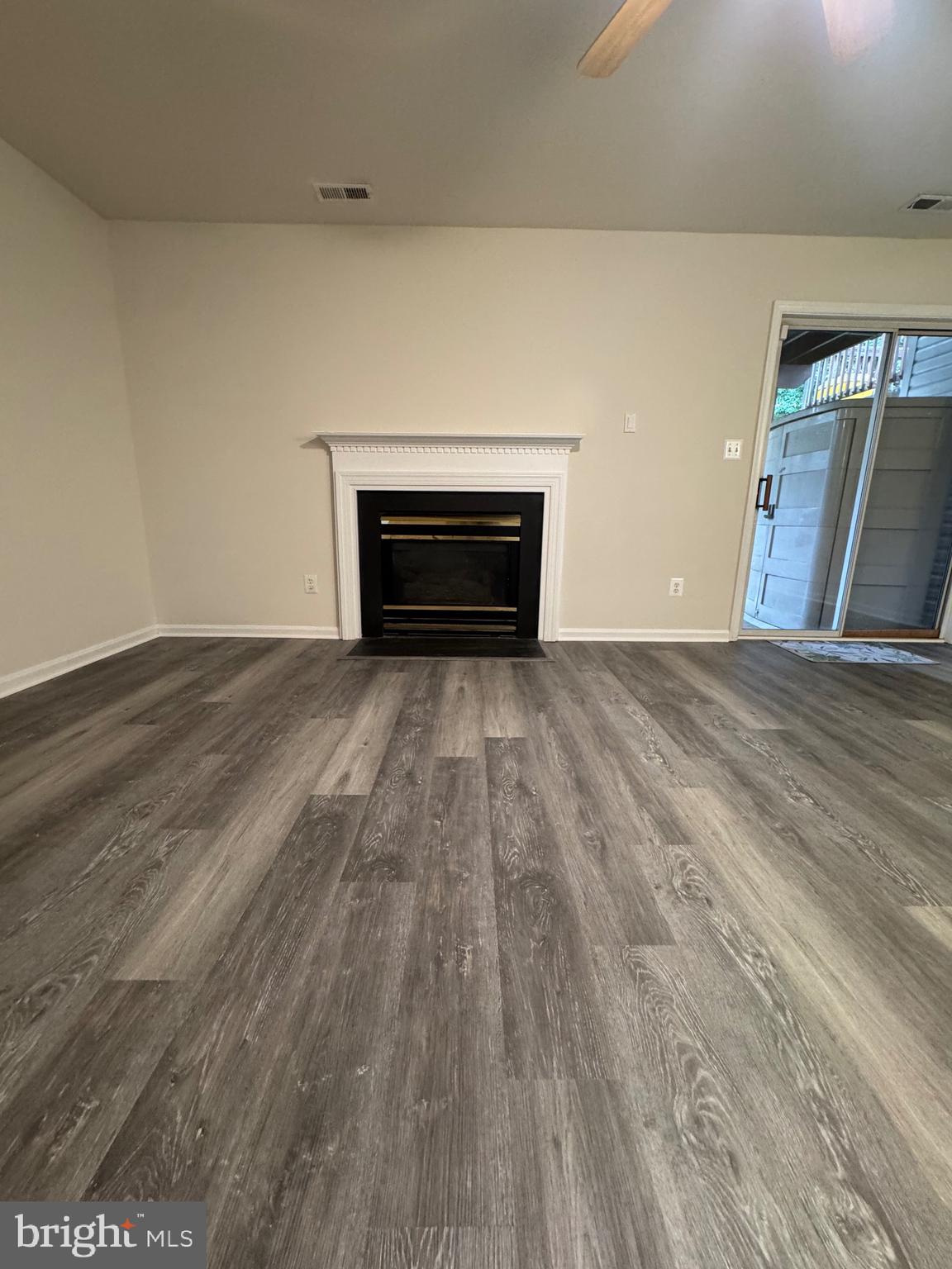 7705 Periwinkle Way, Unit 71 Severn, MD 21144 - Photo 9 of 28 a view of empty room with wooden floor