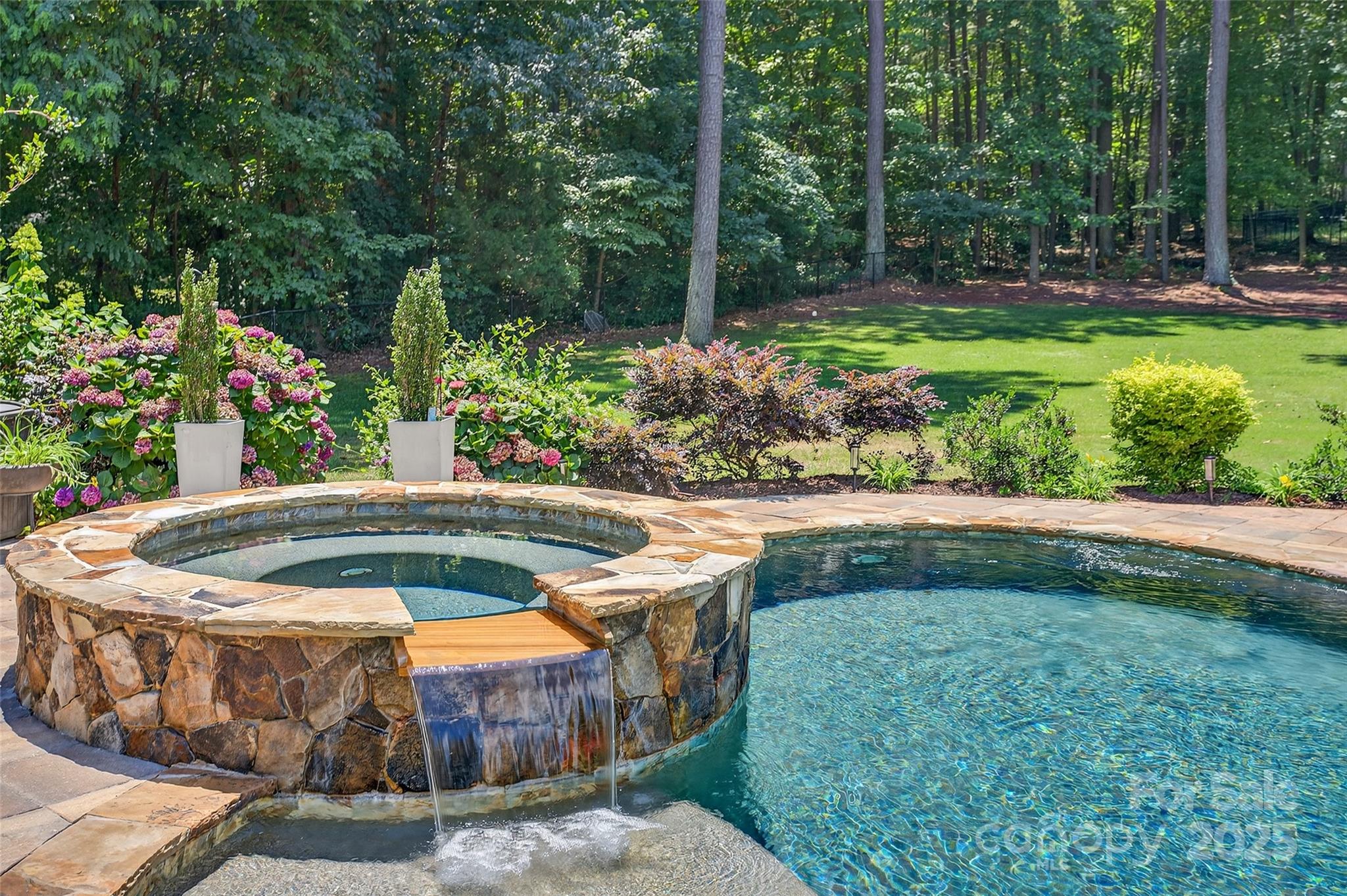 3575 Gordon Street Terrell, NC 28682 - Photo 13 of 48 a view of a fountain in the backyard of a house