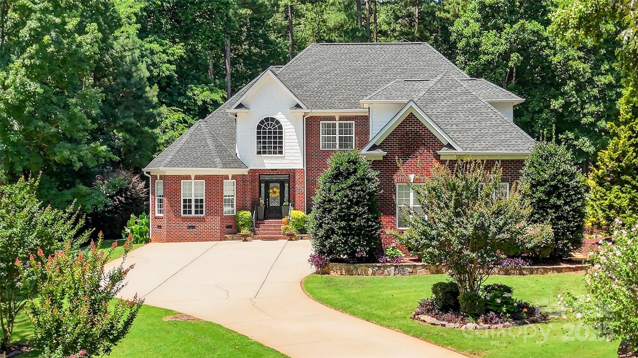 3575 Gordon Street Terrell, NC 28682 - Photo 2 of 48 a view of a house with a yard plants and large tree