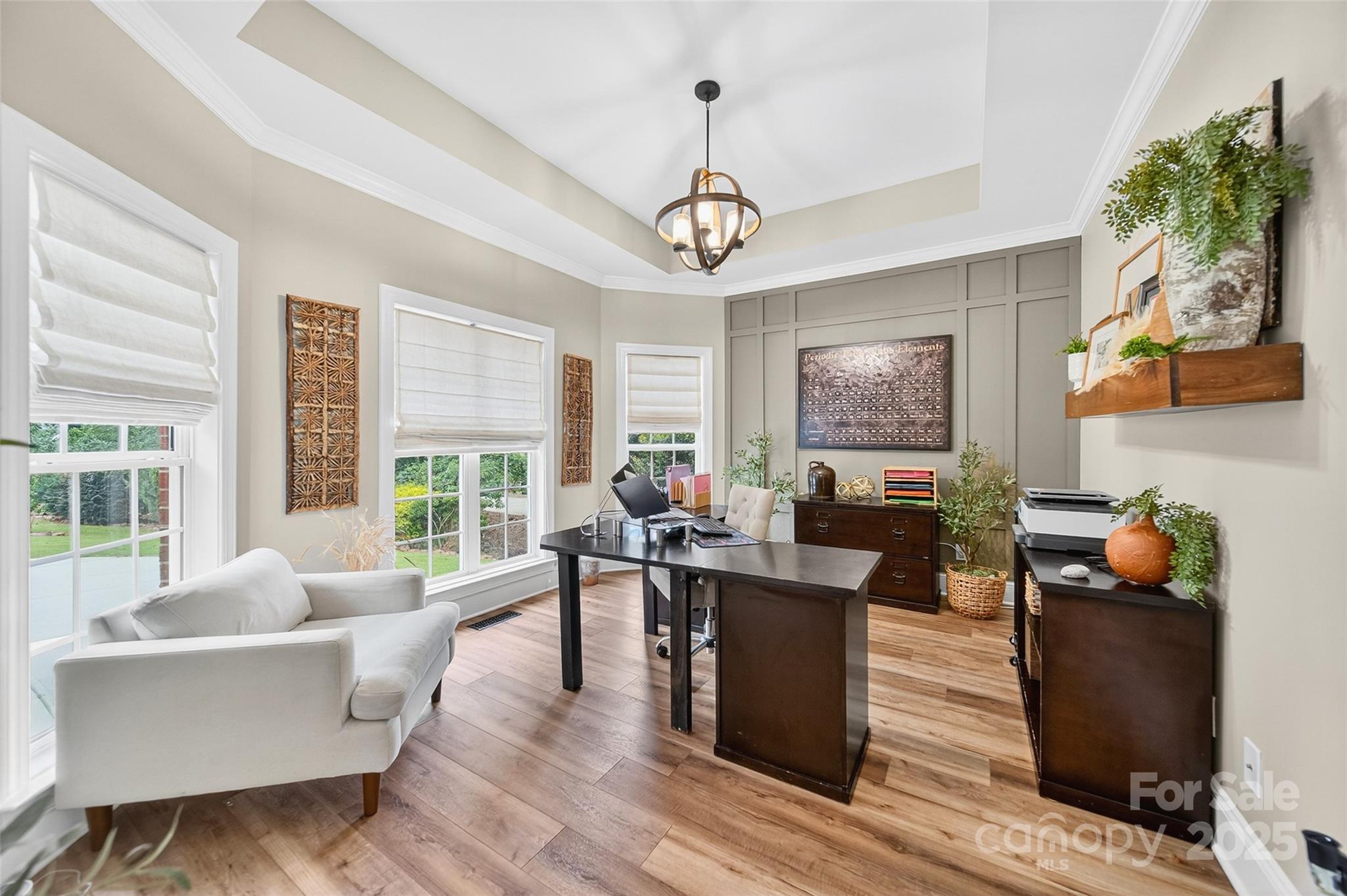 3575 Gordon Street Terrell, NC 28682 - Photo 23 of 48 a living room with furniture a wooden floor and a chandelier