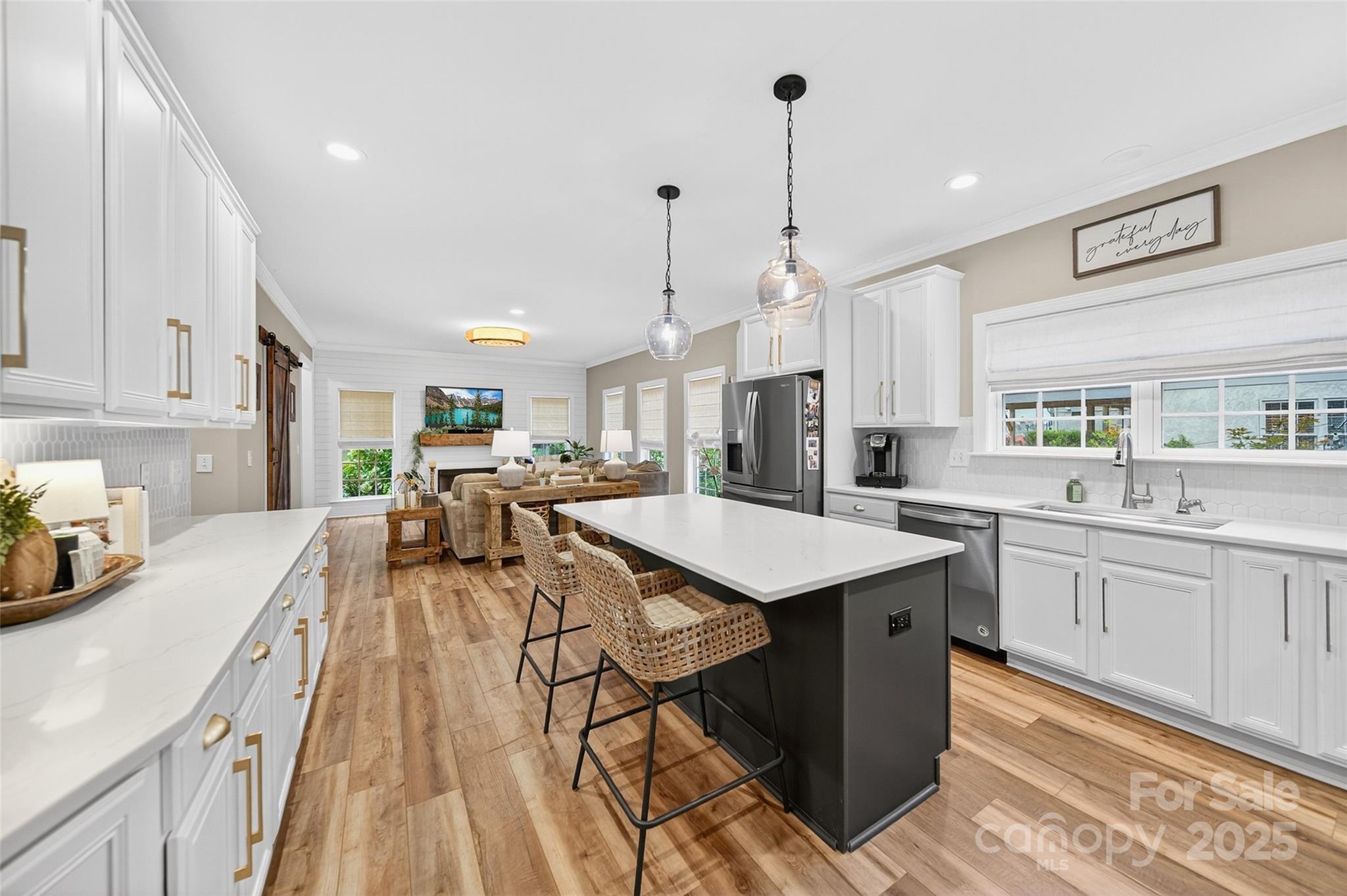 3575 Gordon Street Terrell, NC 28682 - Photo 26 of 48 a kitchen with stainless steel appliances kitchen island granite countertop a sink and cabinets
