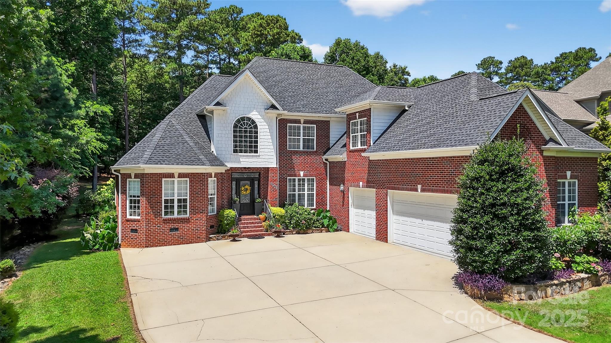 3575 Gordon Street Terrell, NC 28682 - Photo 3 of 48 a front view of a house with a yard and potted plants