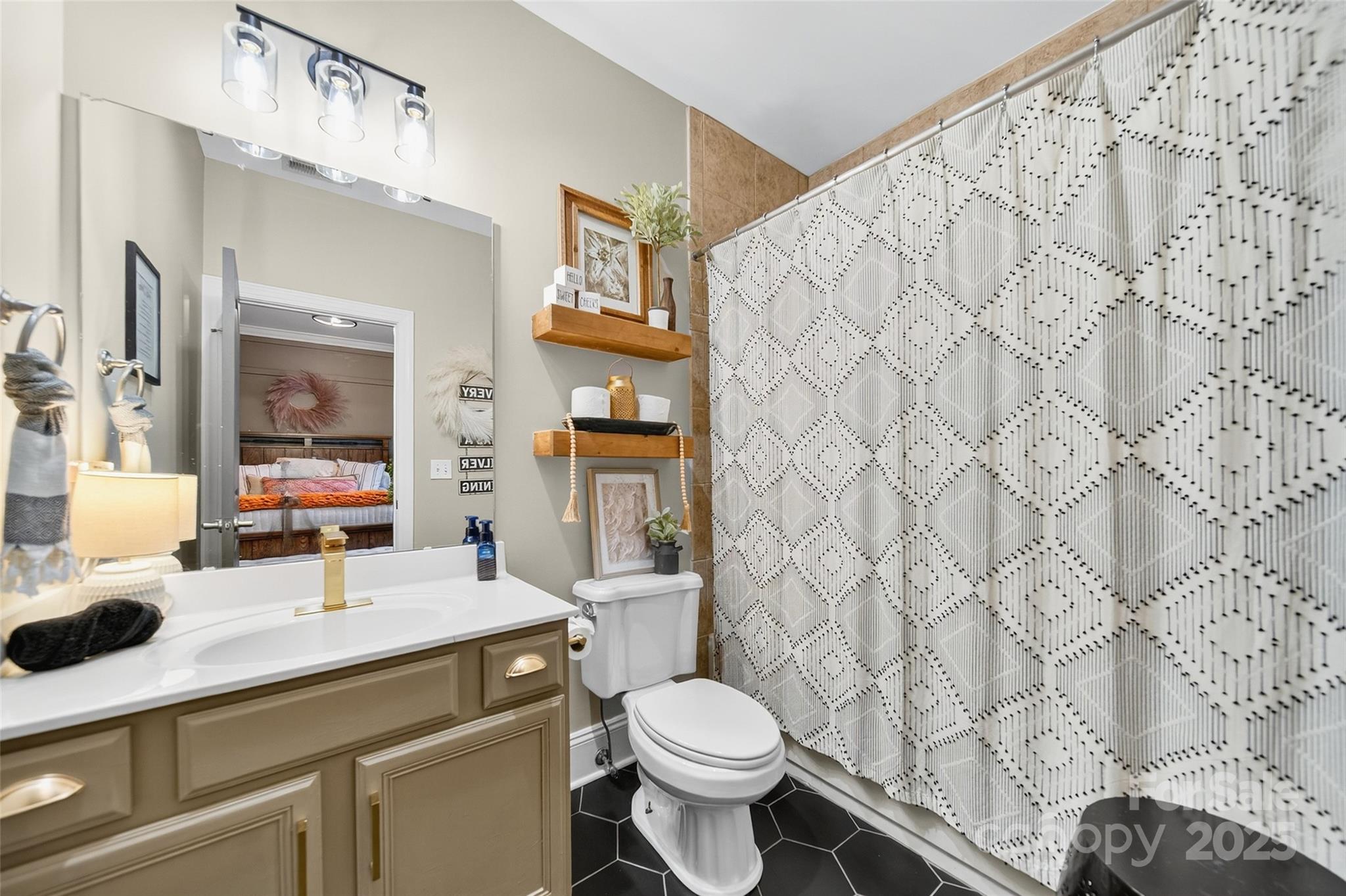 3575 Gordon Street Terrell, NC 28682 - Photo 41 of 48 a bathroom with a granite countertop sink and a toilet