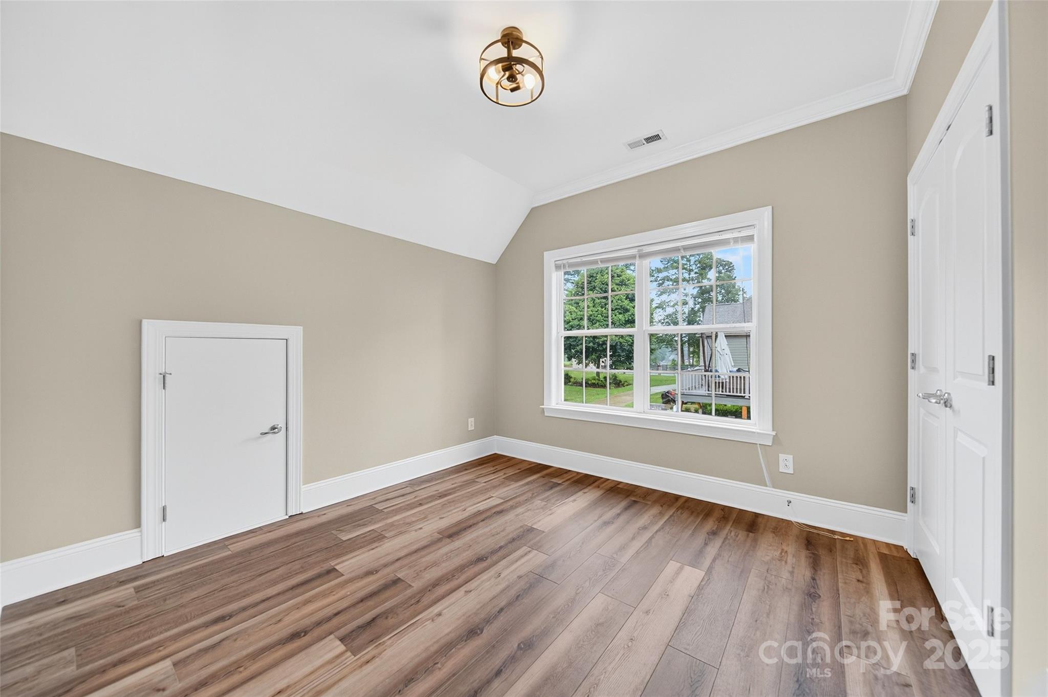 3575 Gordon Street Terrell, NC 28682 - Photo 44 of 48 a view of an empty room with window and wooden floor