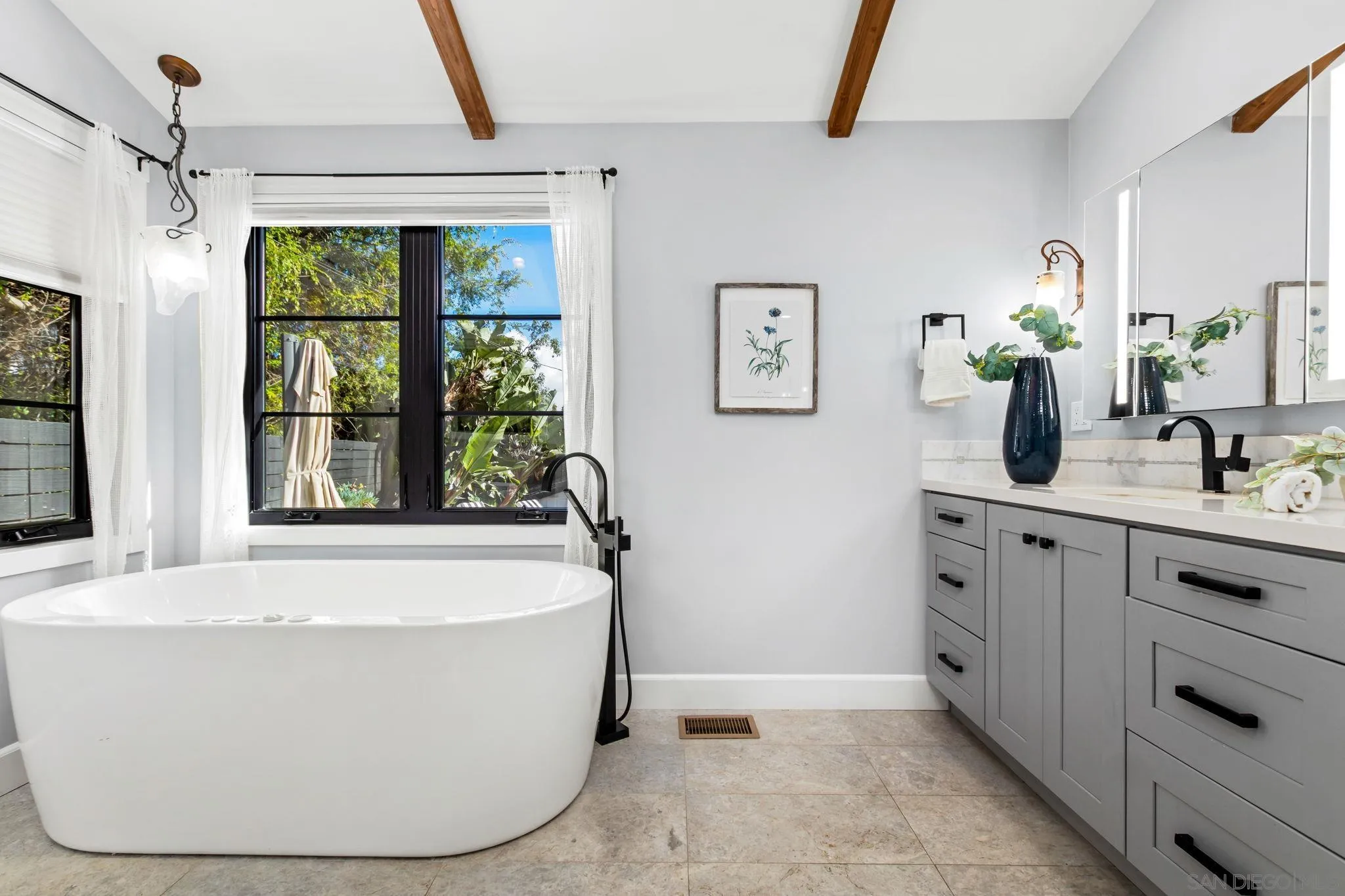 2335 Ivy Road Oceanside, CA 92054 - Photo 24 of 53 a white bath tub sitting in a bathroom