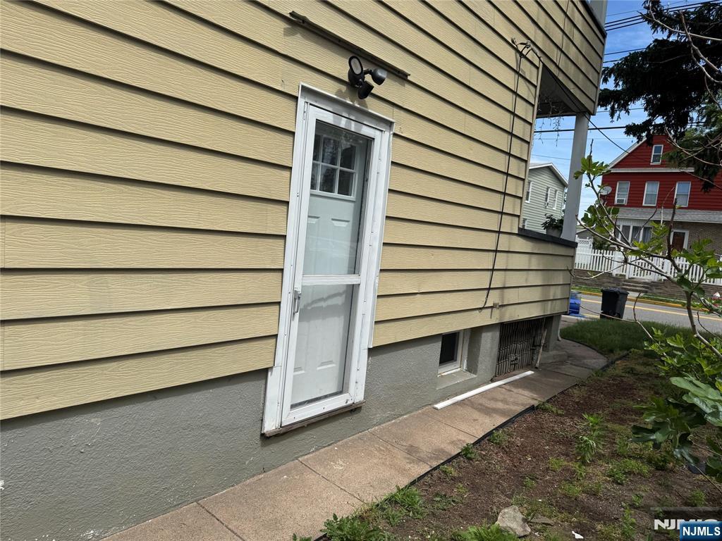 138 Carlton Avenue East Rutherford, NJ 07073 - Photo 2 of 14 a view of a house with a door and wooden bench