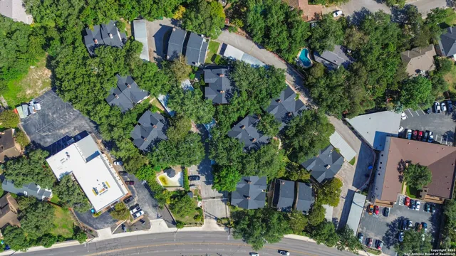 an aerial view of a house with a yard and garden