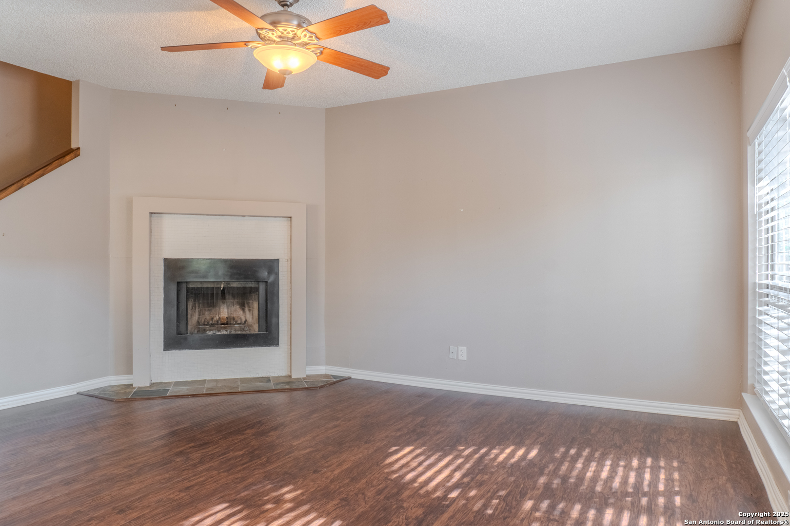 829 West Bitters Road, Unit 503 San Antonio, TX 78216 - Photo 4 of 22 a view of an empty room with window and wooden floor