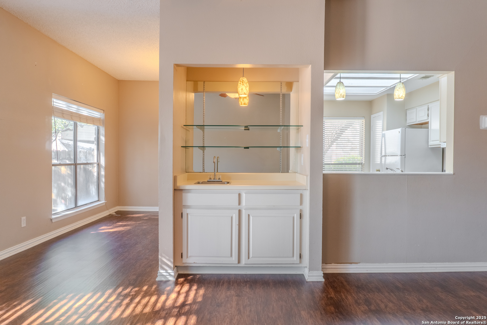 829 West Bitters Road, Unit 503 San Antonio, TX 78216 - Photo 6 of 22 an empty room with wooden floor and windows