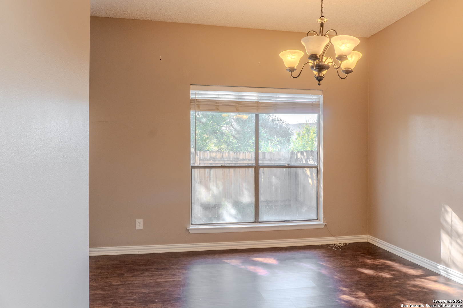 829 West Bitters Road, Unit 503 San Antonio, TX 78216 - Photo 7 of 22 a view of empty room with wooden floor and fan