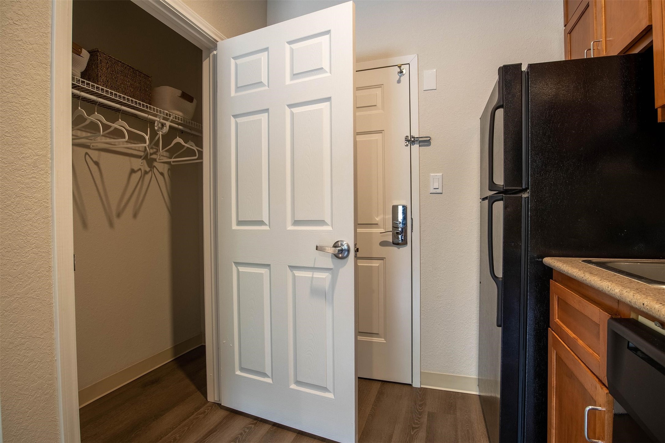 8719 Farm Market 1960 West Road, Unit 220 Houston, TX 77065 - Photo 14 of 50 a view of walk in closet with wooden floor