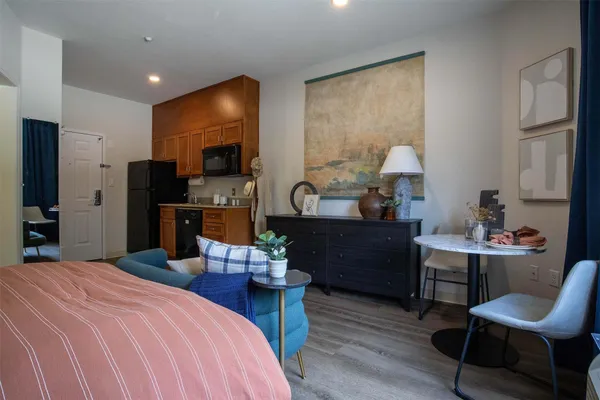 a bed room with a bed and a television