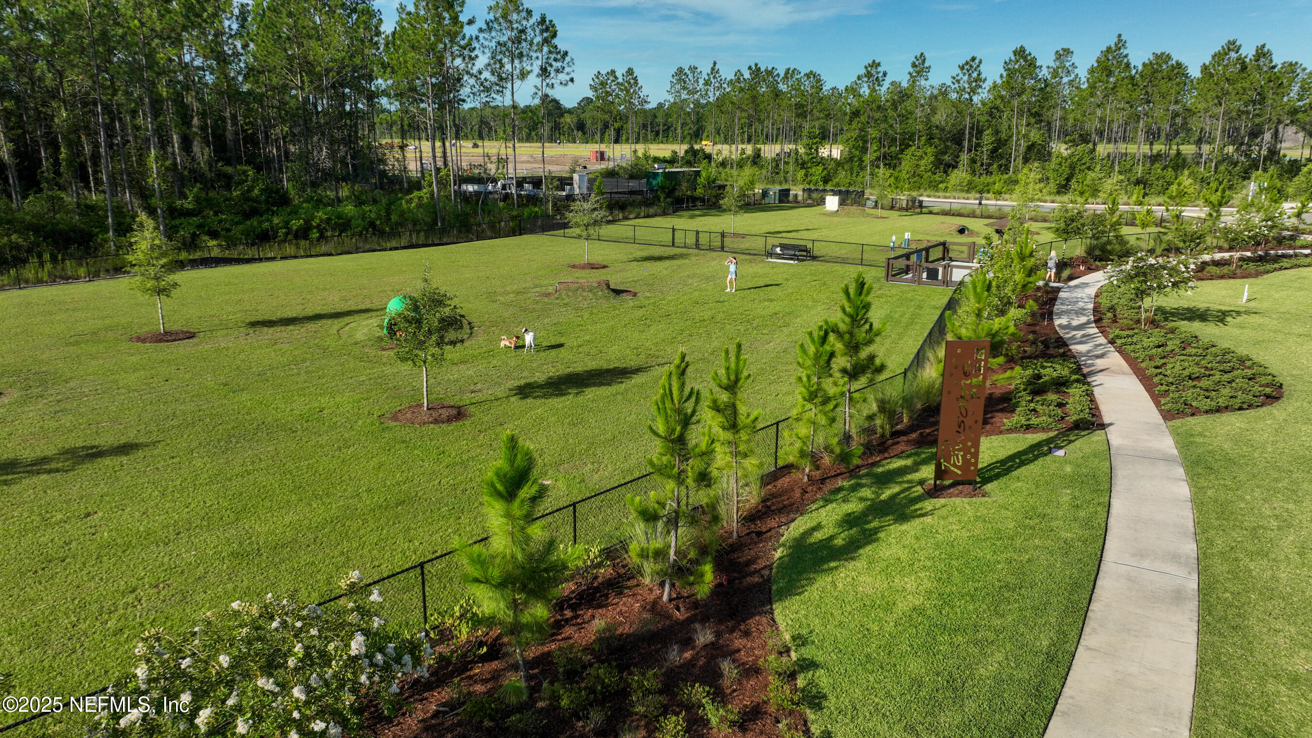75705 Walking Path Lane Yulee, FL 32097 - Photo 13 of 37 a view of a golf course with a lake