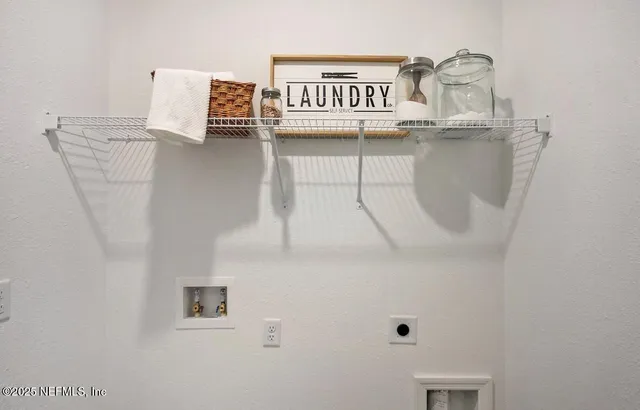 a living room with furniture kitchen view and a potted plant