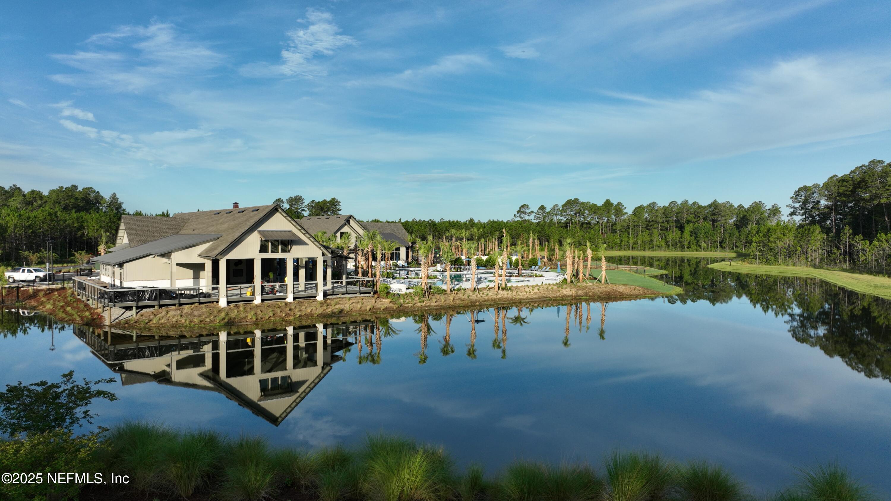 75705 Walking Path Lane Yulee, FL 32097 - Photo 3 of 37 a view of a house with yard and lake view