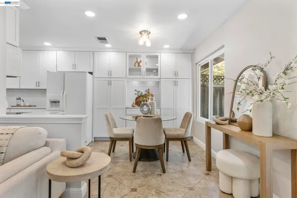 a dining room with furniture and window