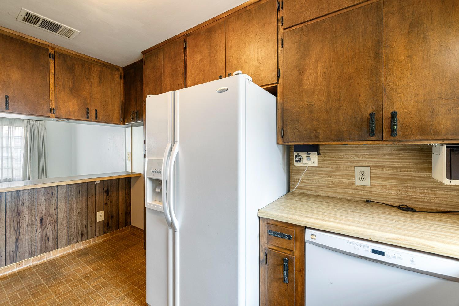 183 Harrison Street Coalinga, CA 93210 - Photo 18 of 45 a white refrigerator freezer sitting inside of a kitchen