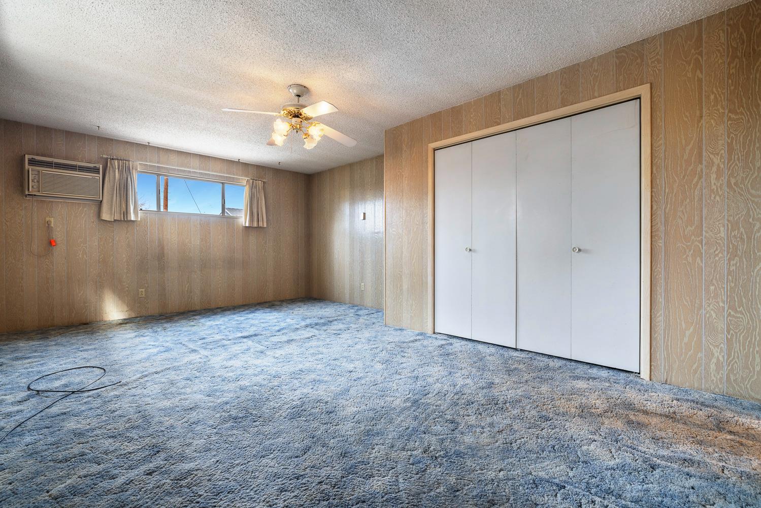 183 Harrison Street Coalinga, CA 93210 - Photo 23 of 45 an empty room with windows and fan