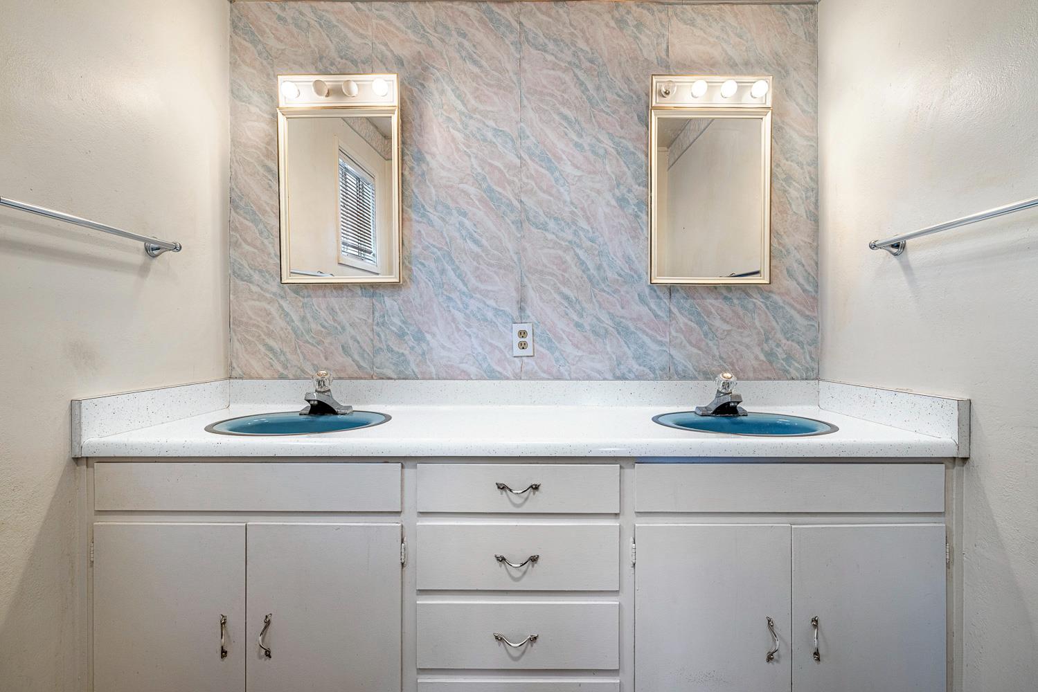 183 Harrison Street Coalinga, CA 93210 - Photo 27 of 45 a bathroom with a sink and vanity