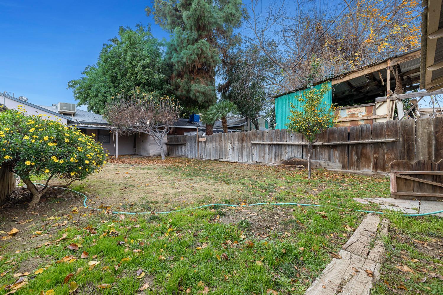 183 Harrison Street Coalinga, CA 93210 - Photo 40 of 45 a view of a backyard with plants and a patio