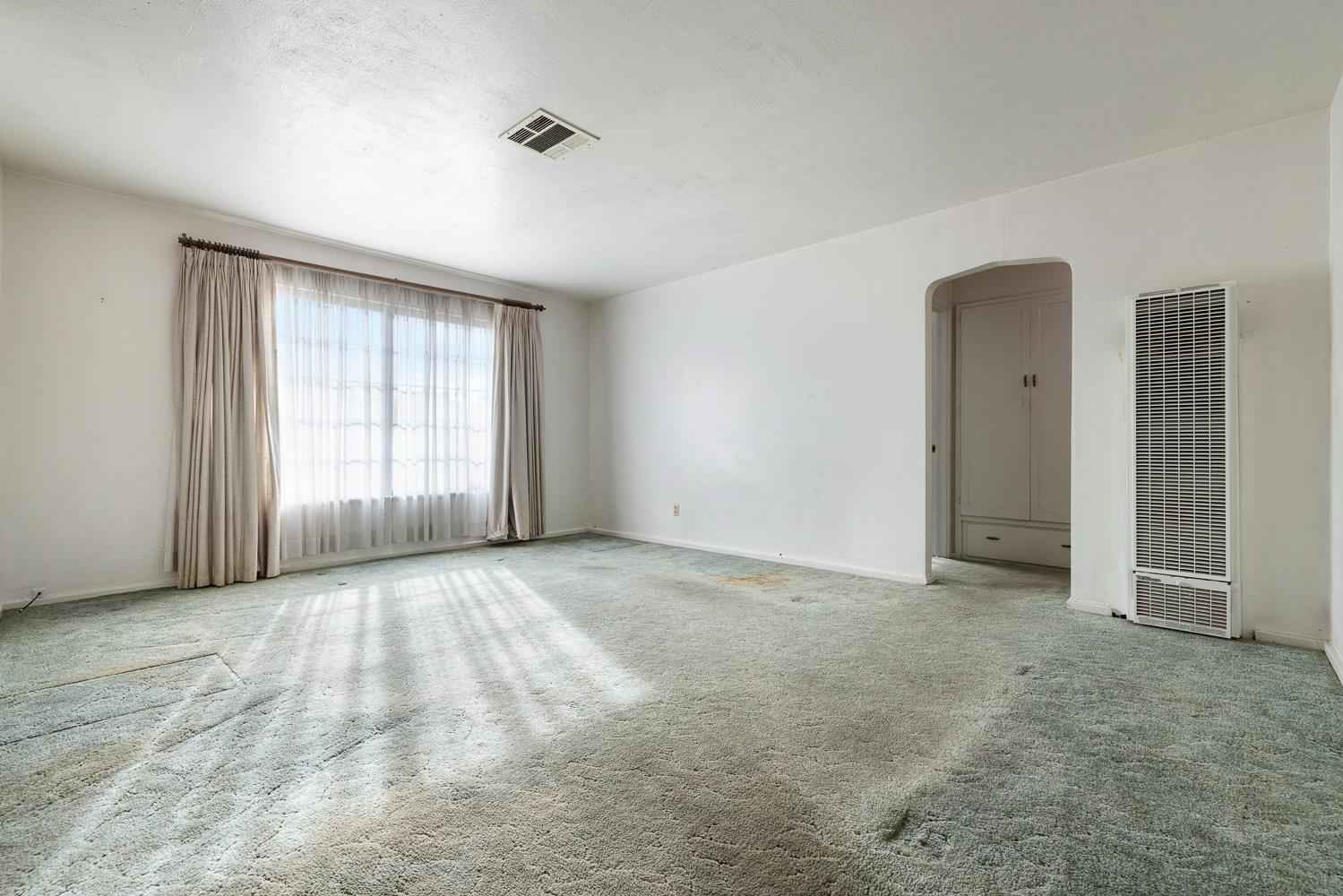 183 Harrison Street Coalinga, CA 93210 - Photo 8 of 45 an empty room with windows and closet