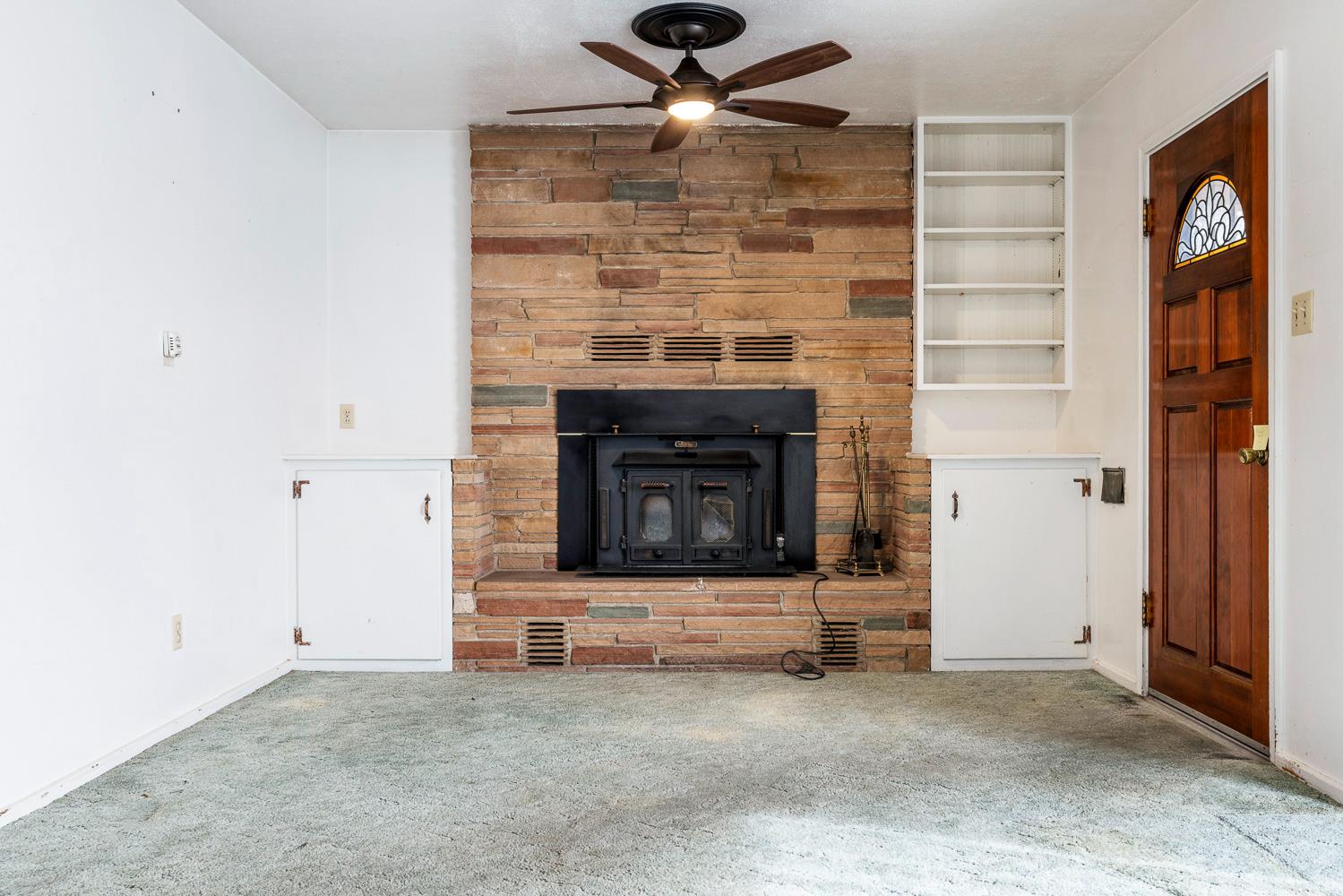 183 Harrison Street Coalinga, CA 93210 - Photo 10 of 45 a living room with a fireplace