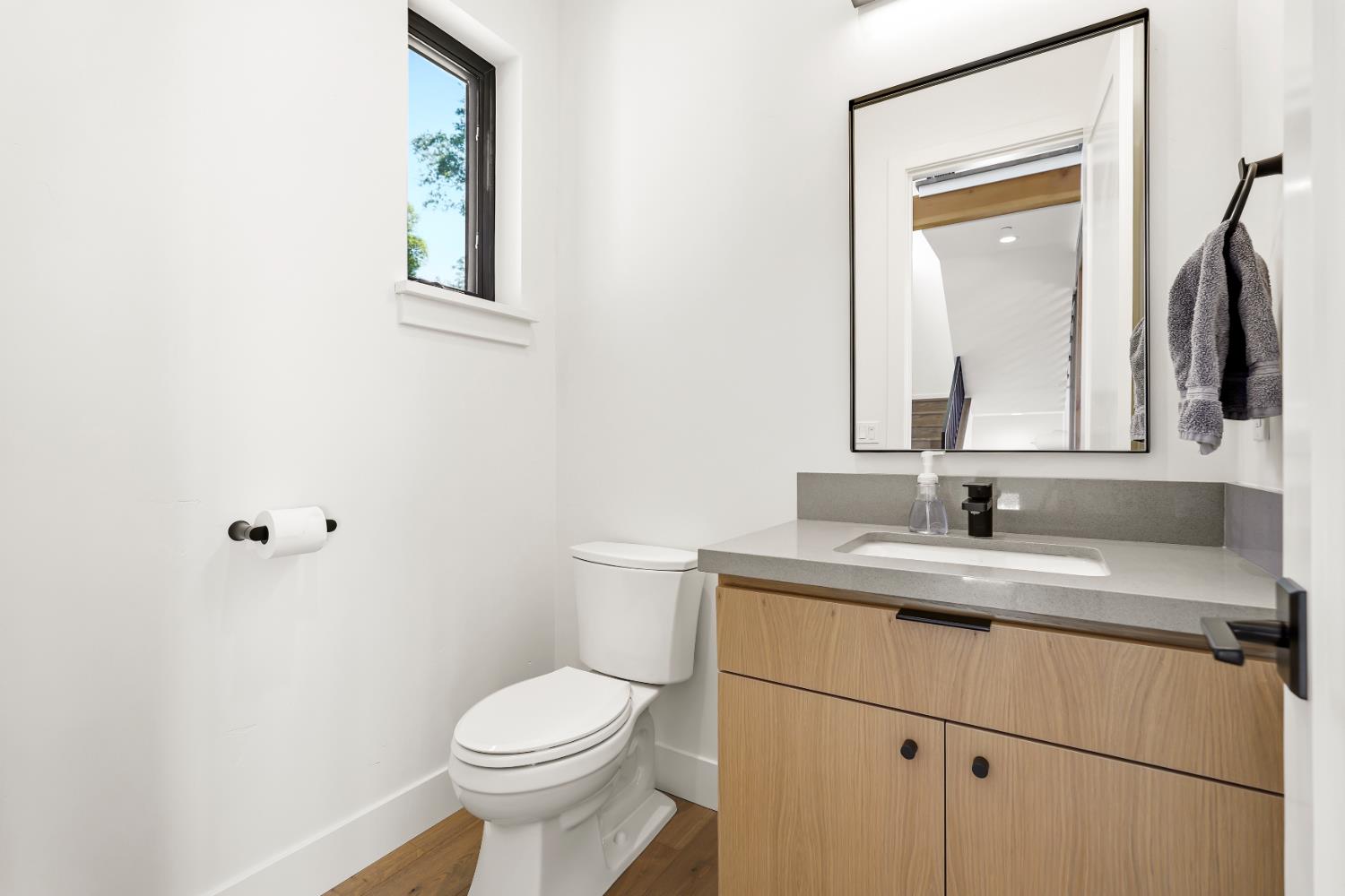 2661 Shirland Tract Road Auburn, CA 95603 - Photo 26 of 87 a bathroom with a toilet sink and mirror