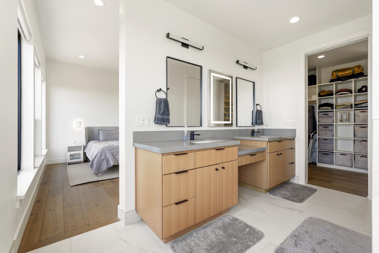 2661 Shirland Tract Road Auburn, CA 95603 - Photo 40 of 87 a en suite bathroom with a granite countertop double vanity sink a mirror and shower
