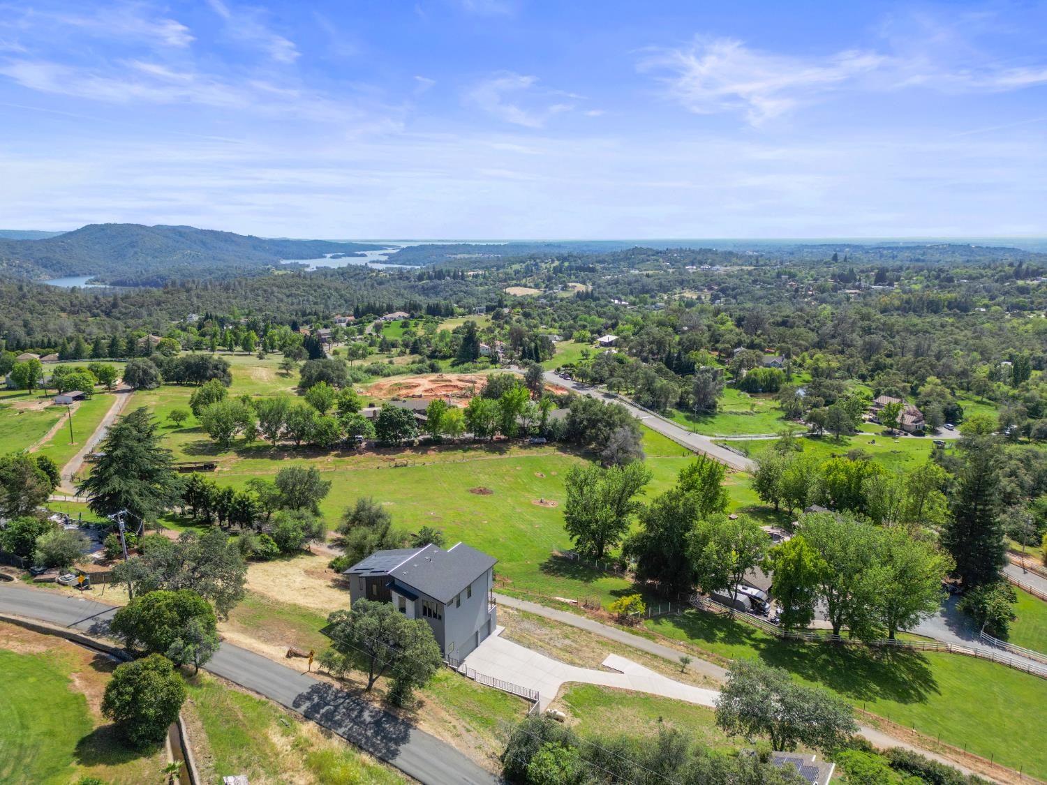 2661 Shirland Tract Road Auburn, CA 95603 - Photo 4 of 87 an aerial view of a house with a yard and lake view