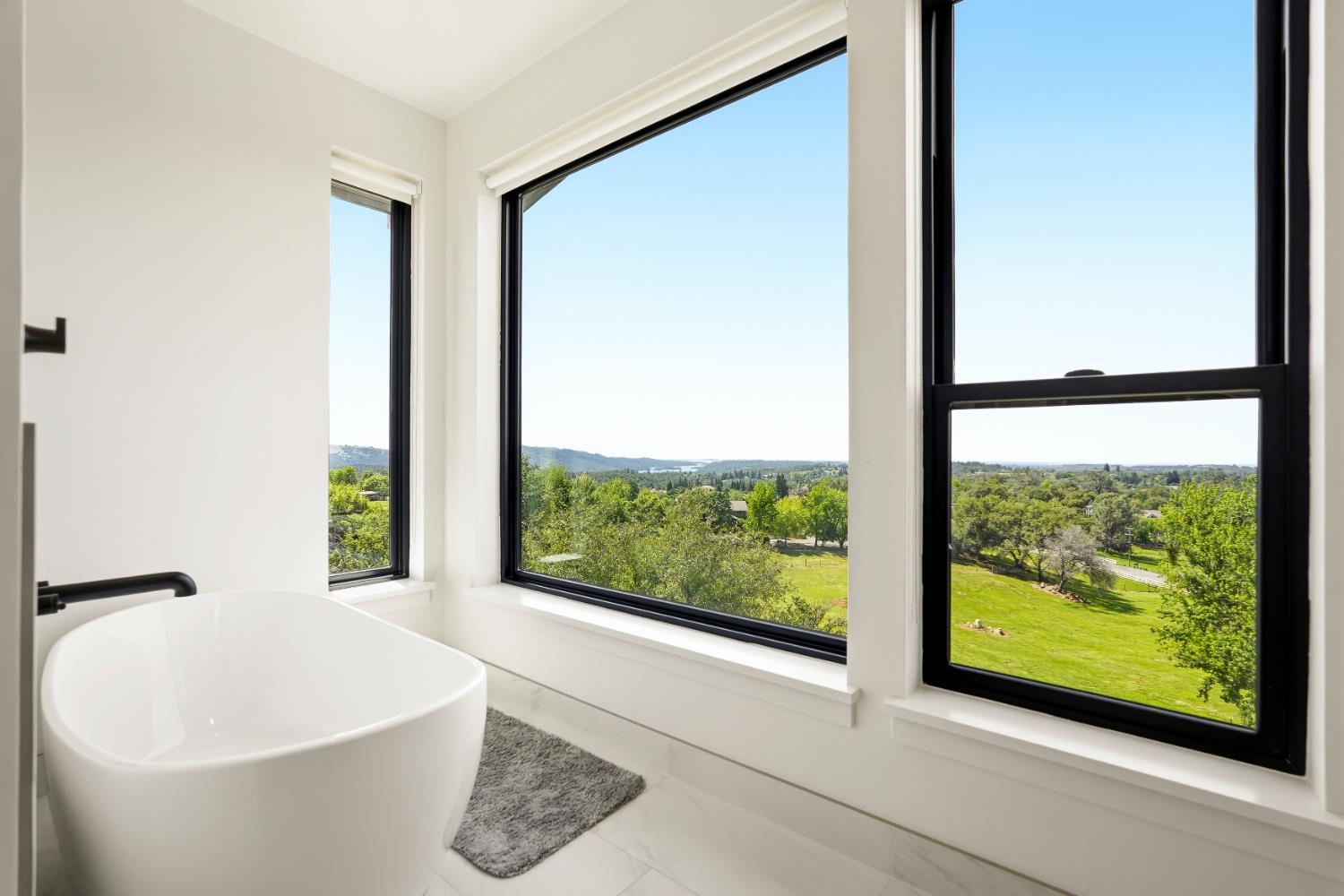 2661 Shirland Tract Road Auburn, CA 95603 - Photo 44 of 87 a white bath tub sitting next to a window