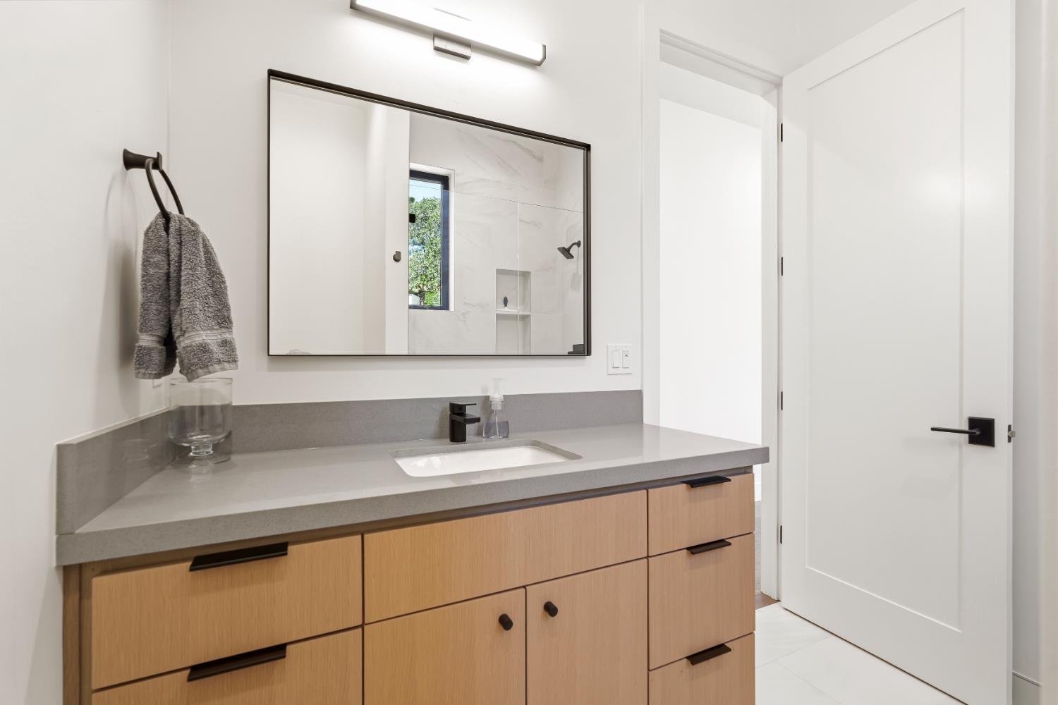 2661 Shirland Tract Road Auburn, CA 95603 - Photo 56 of 87 a bathroom with a sink and a mirror
