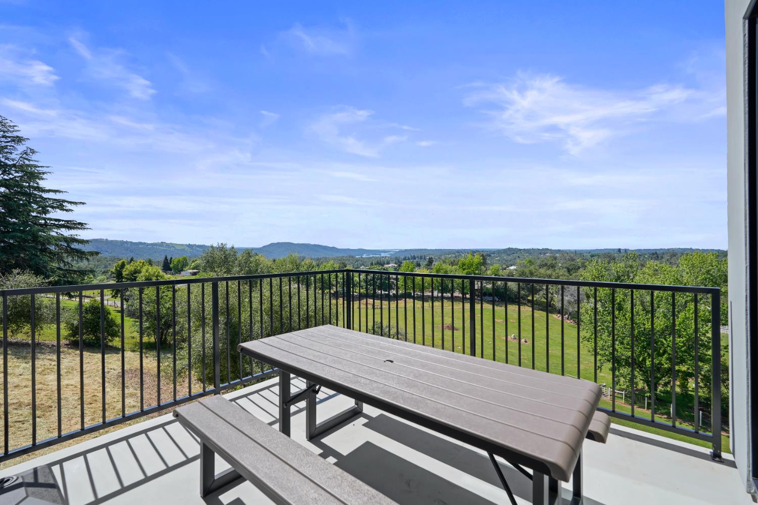 2661 Shirland Tract Road Auburn, CA 95603 - Photo 58 of 87 a view of a deck with two chairs and a table