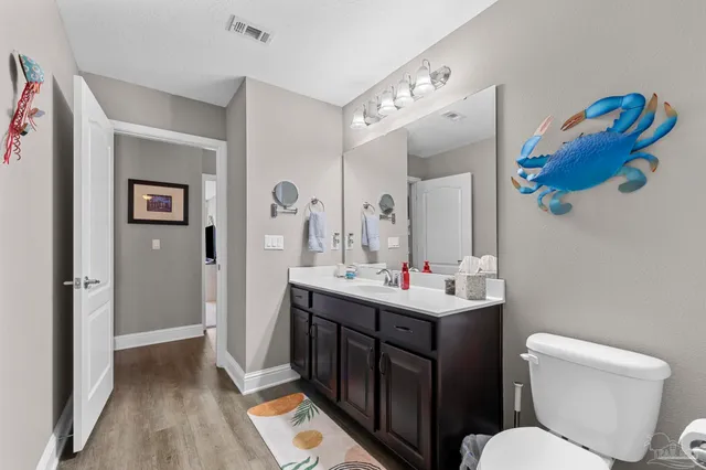 a living room with furniture a flat screen tv and a large window