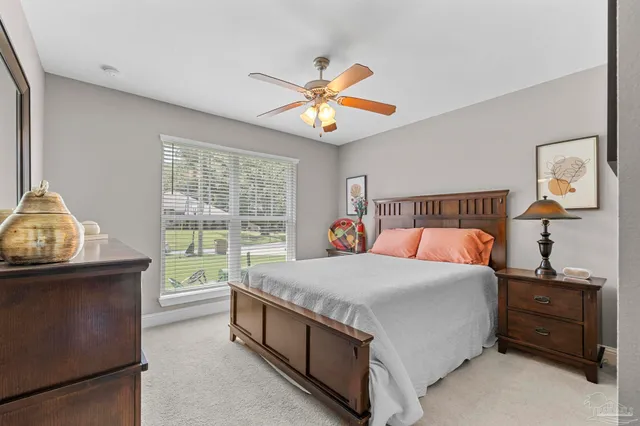 a bedroom with a bed and a dresser