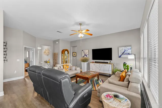 a kitchen with granite countertop a sink stove and refrigerator