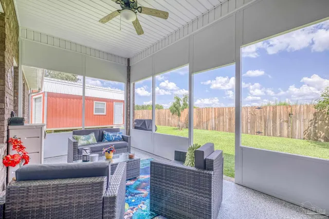 a view of a house with a yard and sitting area