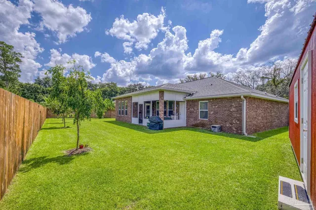 a view of a backyard with pathway