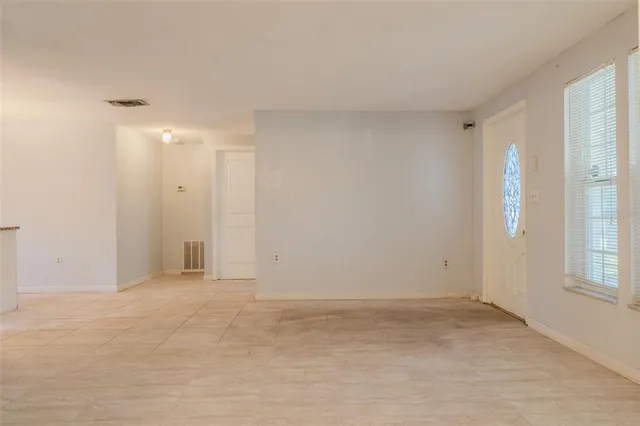 a view of an empty room with a window