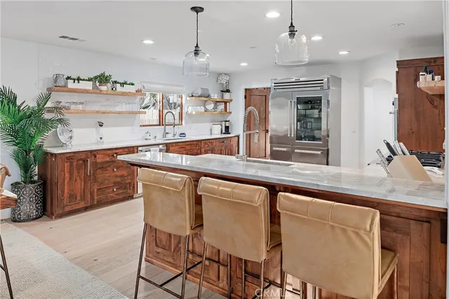 a living room with furniture a flat screen tv and a large window