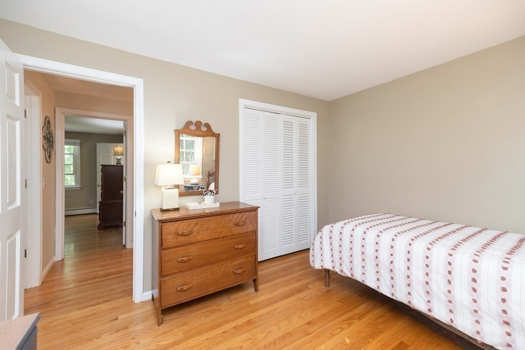 113 Franklin Road Longmeadow, MA 01106 - Photo 24 of 36 a bedroom with a bed and a dresser