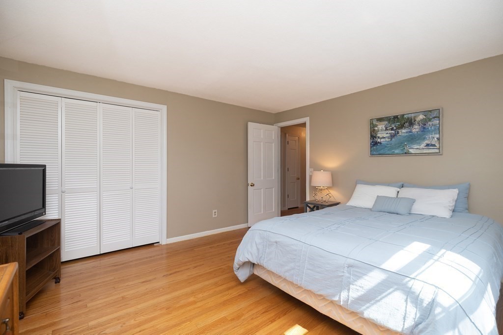 113 Franklin Road Longmeadow, MA 01106 - Photo 26 of 36 a bedroom with a bed and a flat screen tv