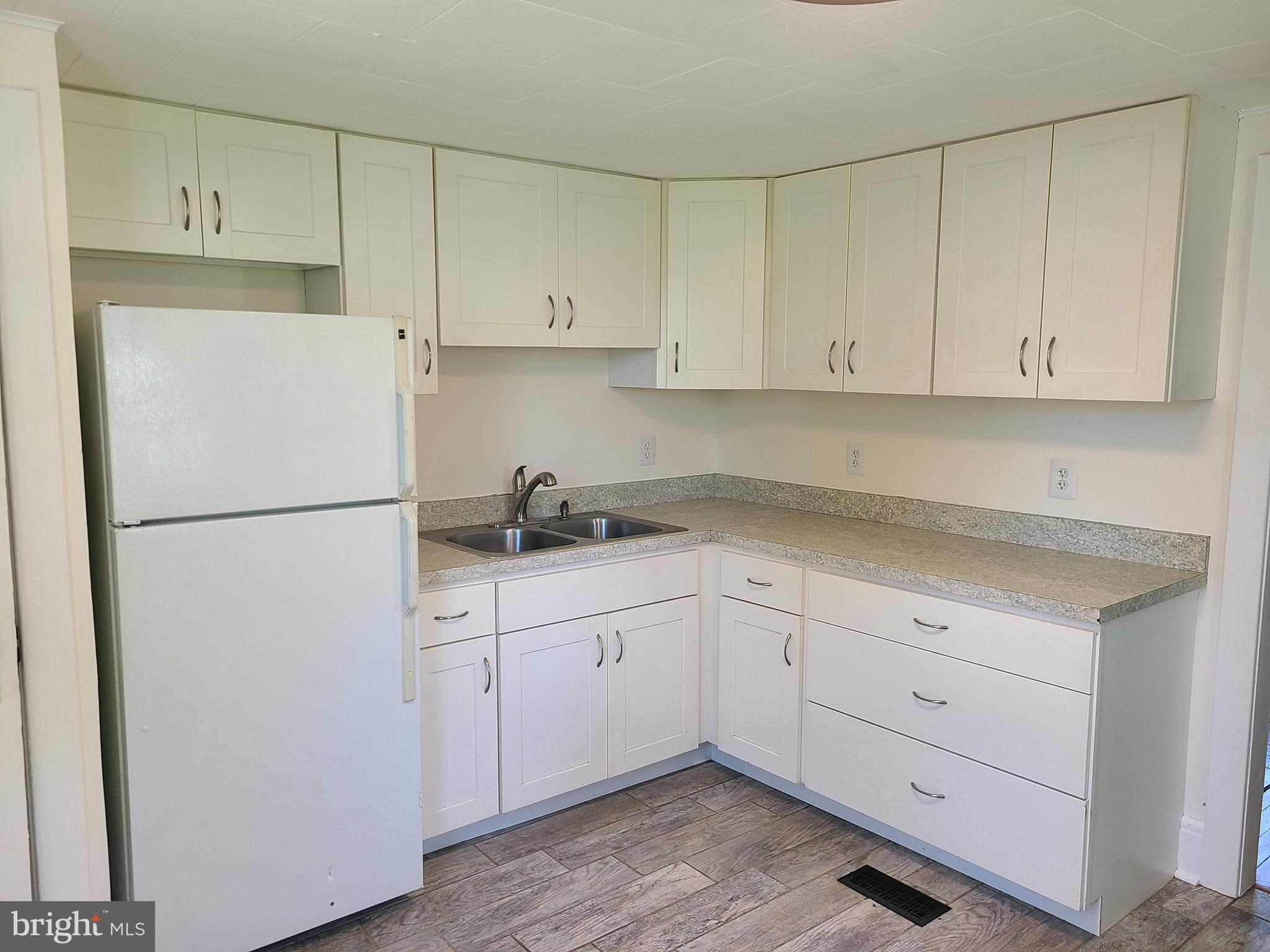 1700 Goodview Road Parkville, MD 21234 - Photo 12 of 50 a kitchen with cabinets appliances a sink and a counter space
