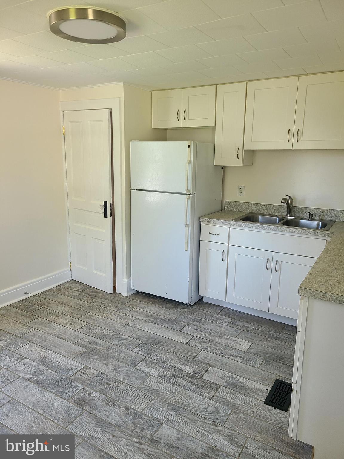 1700 Goodview Road Parkville, MD 21234 - Photo 15 of 50 a kitchen with a sink cabinets and appliances