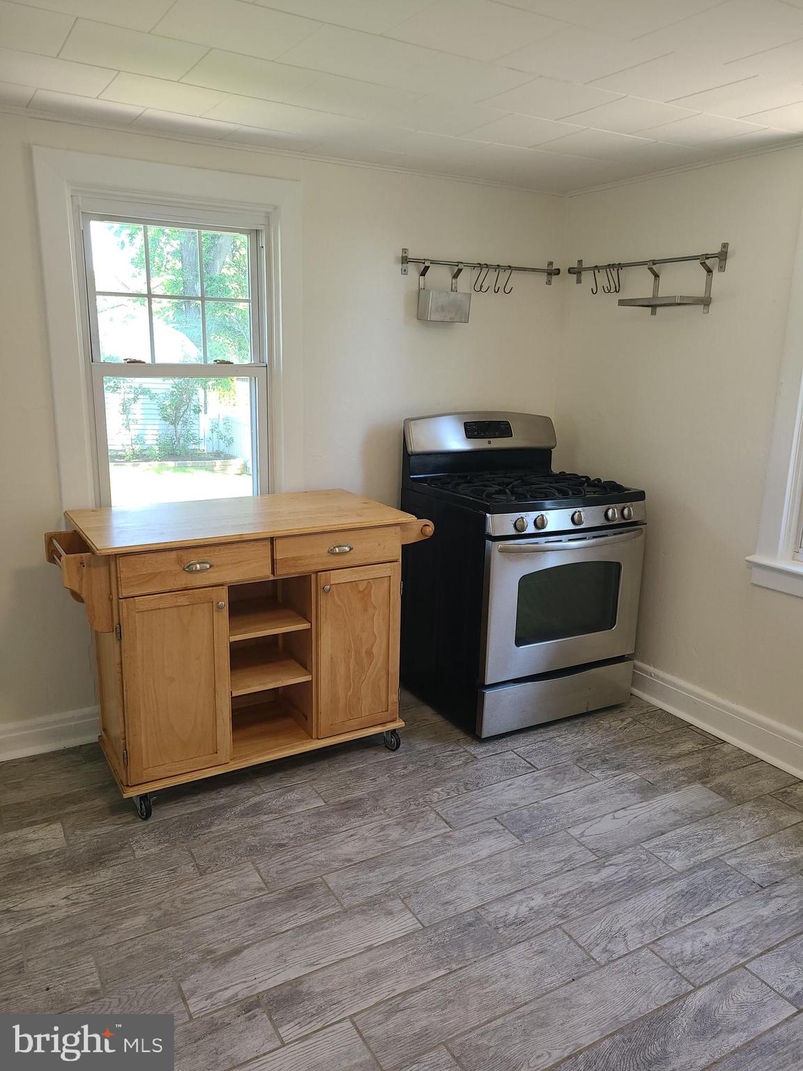 1700 Goodview Road Parkville, MD 21234 - Photo 16 of 50 a kitchen with a stove and a microwave