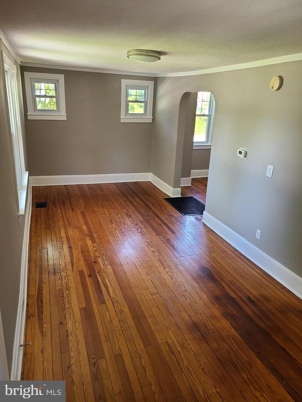 1700 Goodview Road Parkville, MD 21234 - Photo 19 of 50 a view of wooden floor and windows in a room