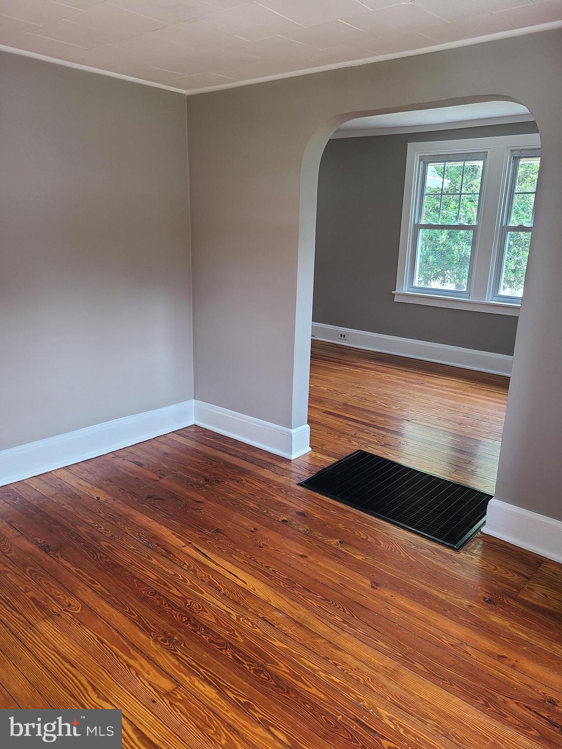 1700 Goodview Road Parkville, MD 21234 - Photo 21 of 50 a view of empty room with window and wooden floor