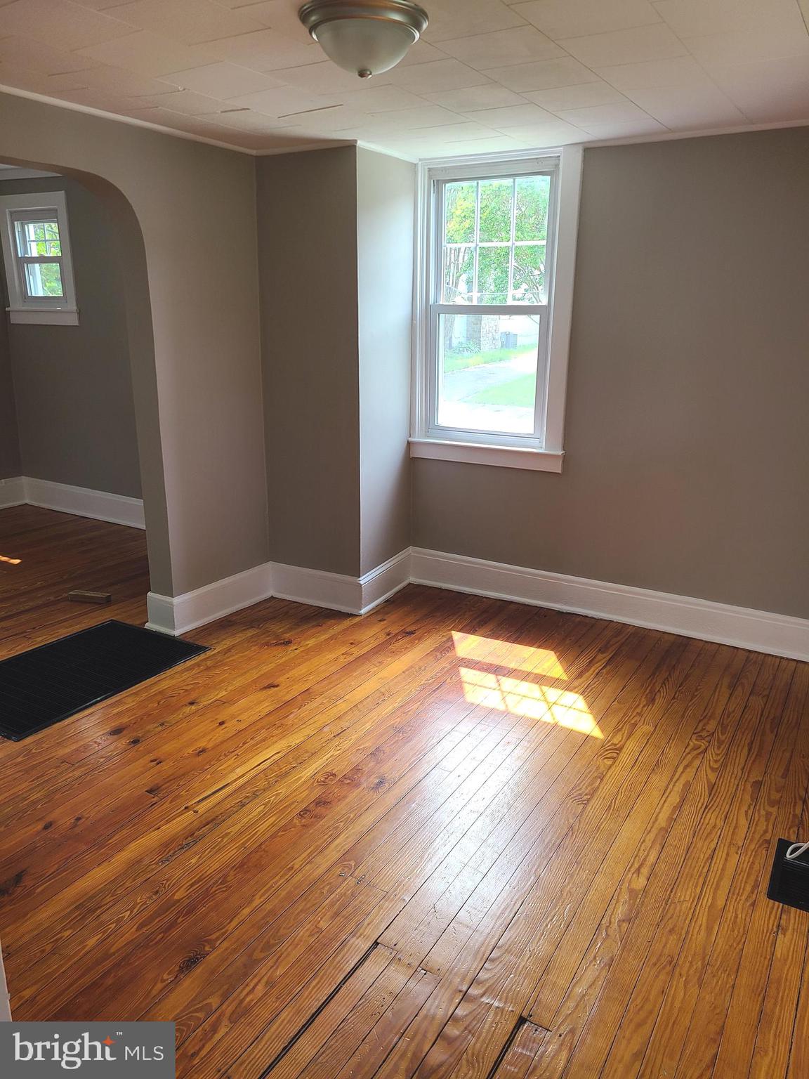 1700 Goodview Road Parkville, MD 21234 - Photo 22 of 50 a view of empty room with wooden floor and fan