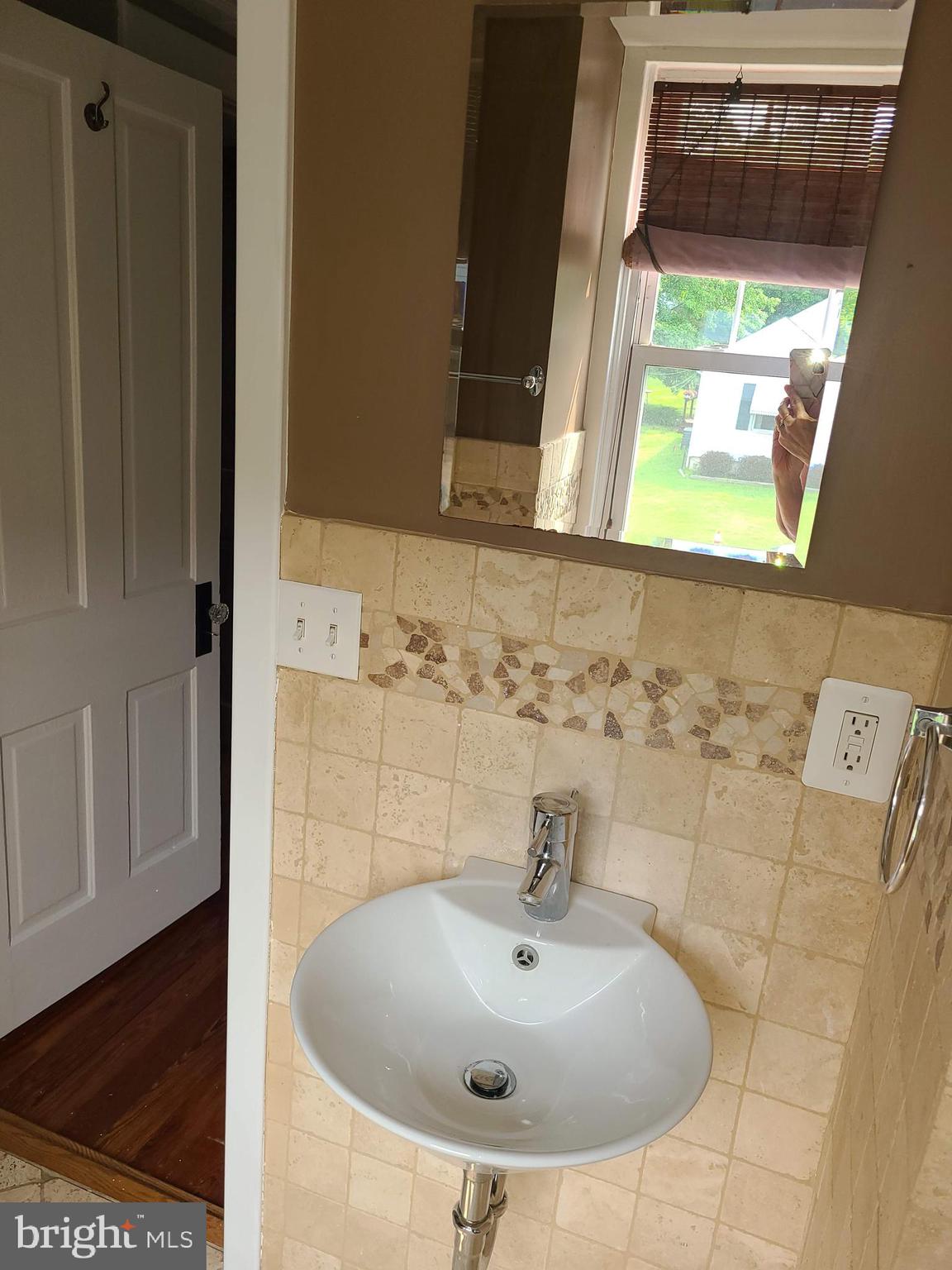 1700 Goodview Road Parkville, MD 21234 - Photo 26 of 50 a bathroom with a sink and a window