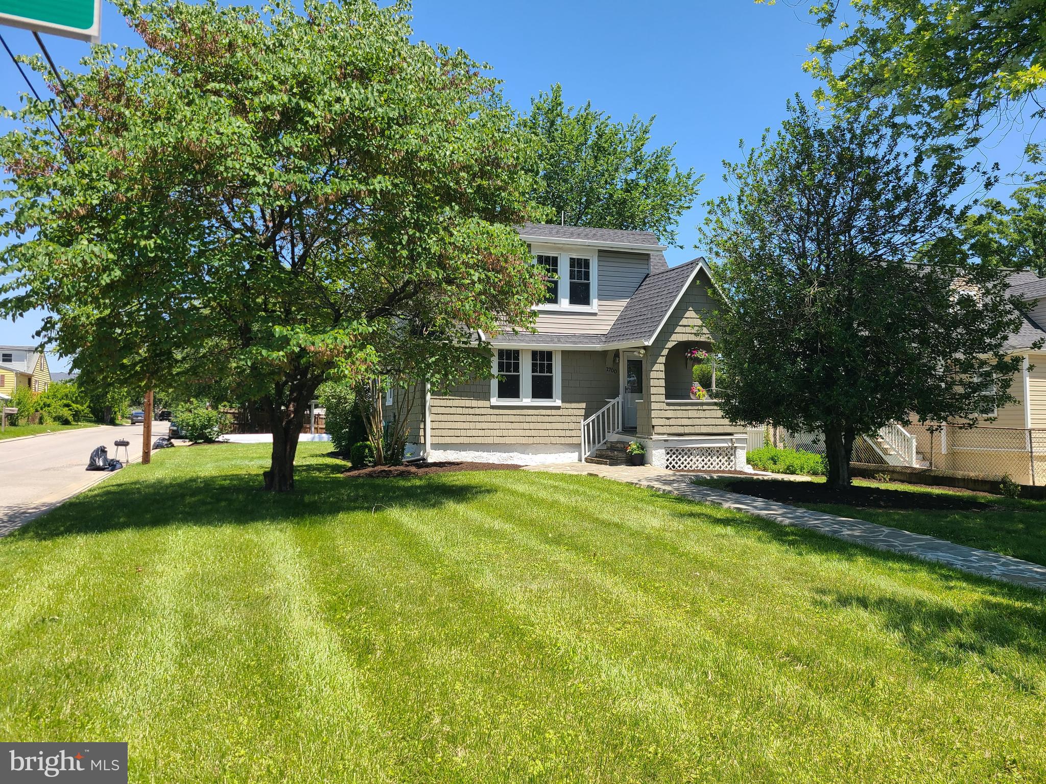 1700 Goodview Road Parkville, MD 21234 - Photo 5 of 50 a view of a house with a patio and a yard